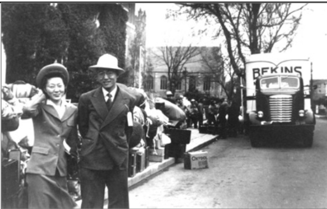 Picture of  Japanese couple in front of moving truck