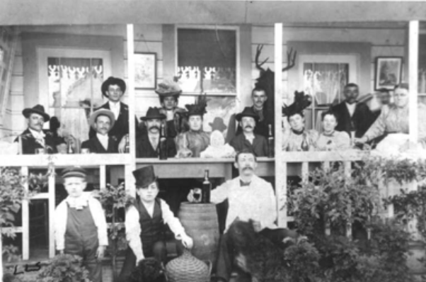 Old picture of people holding various alcoholic beverages
